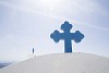 Blue cross on a white roof