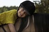 Girl leaning happily on her horse