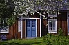 Idyllic red house with blue front door