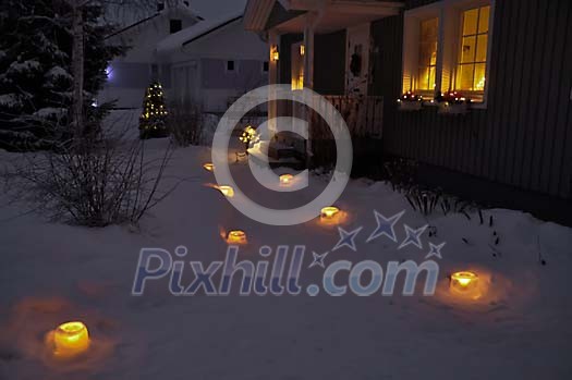 Candles lightning a path to the house Candles lightning a path to the house