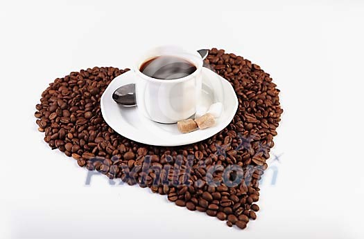 Cup of coffee on the heart made of coffee beans Cup of coffee on the heart made of coffee beans