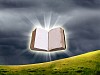 book in the air against green panoramic nature landscape