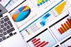 Graphs, charts, business table. The workplace of business people.