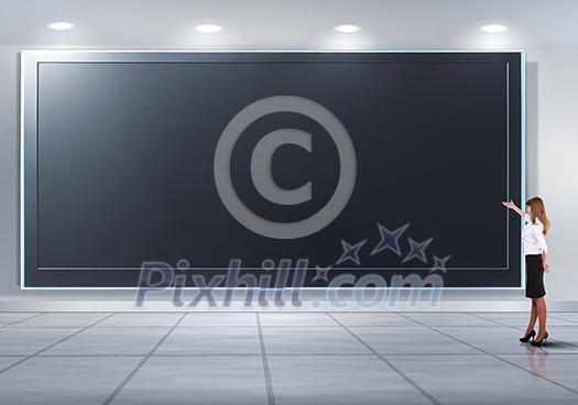 Business person standing near a blank billboard Business person standing near a blank billboard