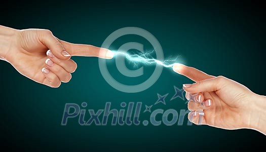 Two human hands in contact with bright flash Two human hands in contact with bright flash