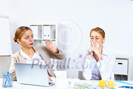 Young woman feeling unwell and sick in office Young woman feeling unwell and sick in office