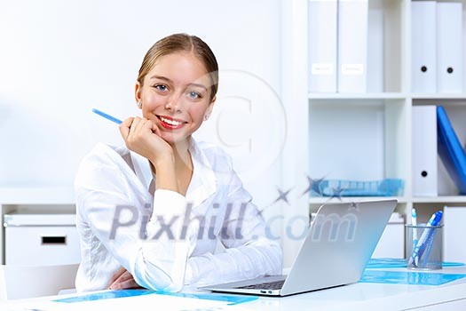 Young pretty woman in business wear working in office Young pretty woman in business wear working in office