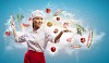 Asian female cook with knife cutting fruits and vegetables in air