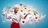 Asian female cook with knife cutting fruits and vegetables in air