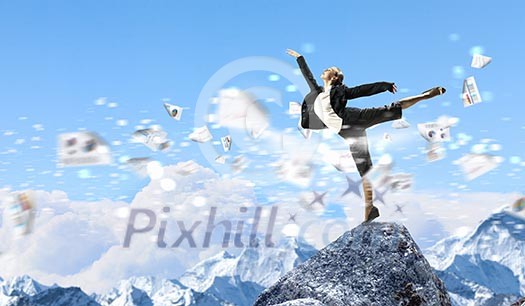 young businesswoman standing on one leg atop of mountain against diagram background young businesswoman standing on one leg atop of mountain against diagram background