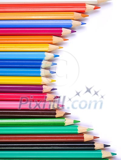 Colored pencils on a white background. Colored pencils on a white background.