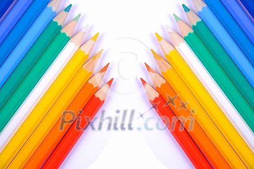 Colored pencils on a white background. Colored pencils on a white background.