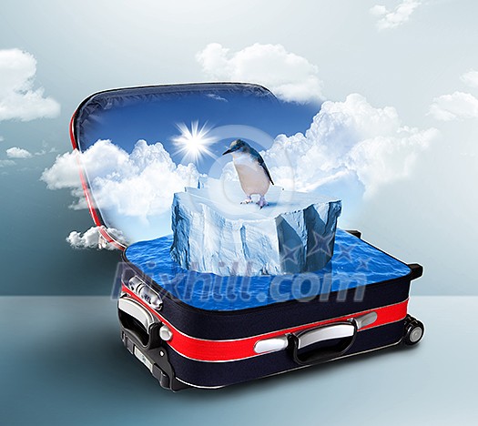 Red suitcase with big floating iceberge inside Red suitcase with big floating iceberge inside