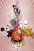 Image of a guitar against decorative background