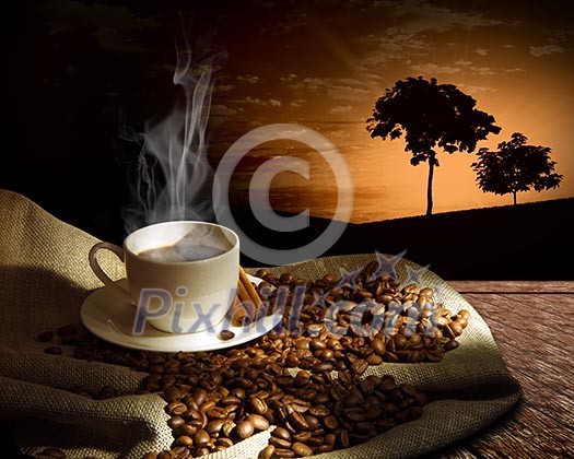 Steaming cup of coffee, cinnamon sticks and a few coffee beans. still life