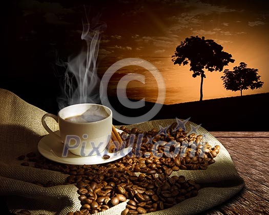 Steaming cup of coffee, cinnamon sticks and a few coffee beans. still life Steaming cup of coffee, cinnamon sticks and a few coffee beans. still life