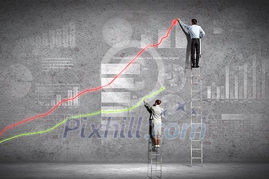 businesspeople standing on ladder drawing diagrams and graphs on wall businesspeople standing on ladder drawing diagrams and graphs on wall