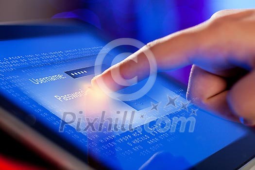 Closeup of finger touching blue toned screen on tablet-pc Closeup of finger touching blue toned screen on tablet-pc