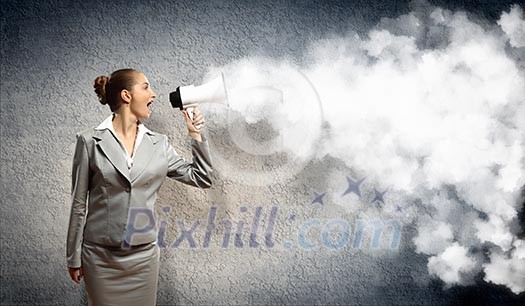 businesswoman in grey suit screaming into megaphone businesswoman in grey suit screaming into megaphone