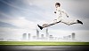 Young businessman in suit running on the road