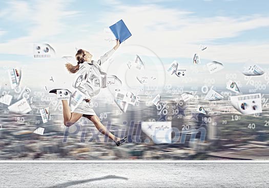 Image of a businesswoman jumping high against financial background Image of a businesswoman jumping high against financial background