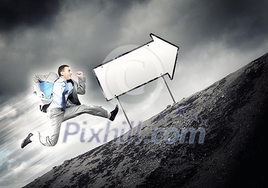 Young businessman in suit running on the road Young businessman in suit running on the road