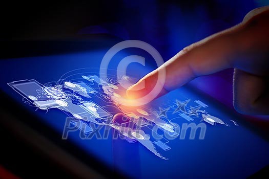 Closeup of finger touching blue toned screen on tablet-pc Closeup of finger touching blue toned screen on tablet-pc