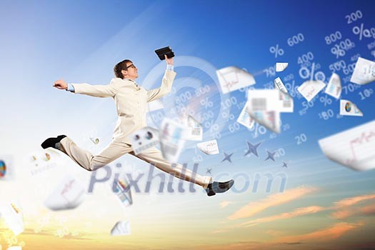 Image of a businessman jumping high against blue sky background Image of a businessman jumping high against blue sky background