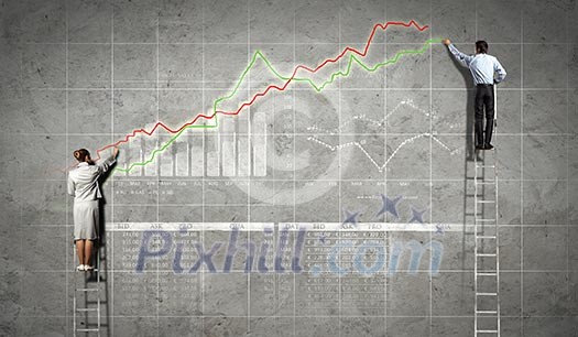 businesspeople standing on ladder drawing diagrams and graphs on wall businesspeople standing on ladder drawing diagrams and graphs on wall