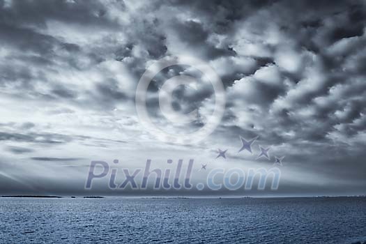 Grey cloudy sky over the sea Grey cloudy sky over the sea