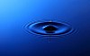 Drop of water falling into the water and leaving it circles.