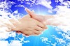 Handshake of two business people against the sky. Symbol of successful business