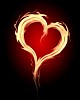 burning heart with flames against dark background