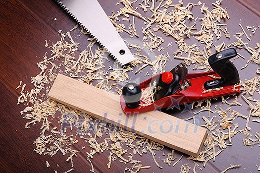 Shavings of wood, brick and red plane Shavings of wood, brick and red plane