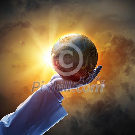 Hand of businessman holding earth planet against illustration background Hand of businessman holding earth planet against illustration background