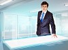 Image of young businessman looking at high-tech picture