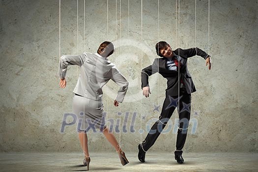 Image of businesspeople hanging on strings like marionettes. Conceptual photography Image of businesspeople hanging on strings like marionettes. Conceptual photography