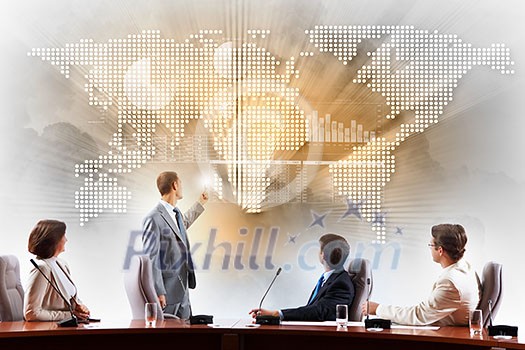Image of businesspeople at presentation looking at virtual project Image of businesspeople at presentation looking at virtual project