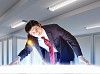 Image of young businessman looking at high-tech picture