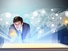Image of young businessman clicking icon on high-tech picture