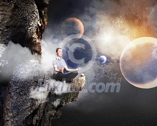 Businesswoman sitting in lotus flower position against space background Businesswoman sitting in lotus flower position against space background