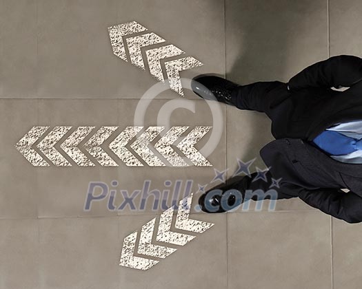 Top view of businessman standing against directions background Top view of businessman standing against directions background