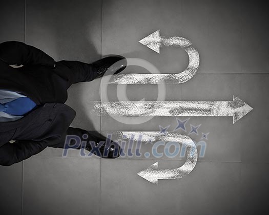 Top view of businessman standing against directions background Top view of businessman standing against directions background