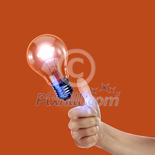 Human hand holding a shining electric bulb Human hand holding a shining electric bulb