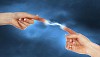 Two human hands in contact with bright flash