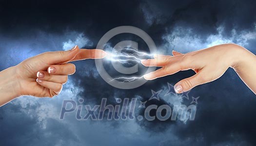 Two human hands in contact with bright flash Two human hands in contact with bright flash