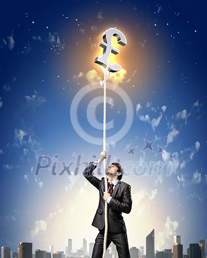 Image of businessman climbing rope attached to pound sign Image of businessman climbing rope attached to pound sign