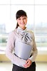 Young business woman in an office at the workplace.