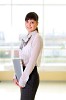Young business woman in an office at the workplace.