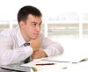 Young business man in the office workplace.